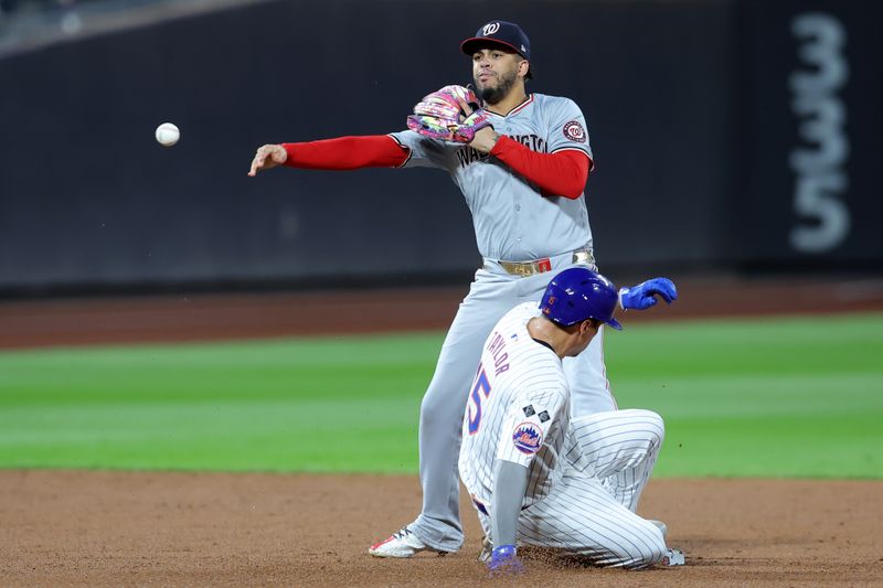 Sep 17, 2024; New York City, New York, USA; Washington Nationals second baseman Luis Garcia Jr. (2) forces out New York Mets left fielder Tyrone Taylor (15) at second base and throws to first to complete a double play on a ball hit by Mets catcher Francisco Alvarez (not pictured) during the second inning at Citi Field. Mandatory Credit: Brad Penner-Imagn Images