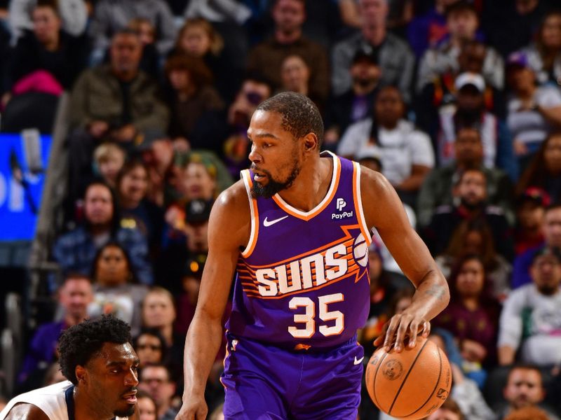 PHOENIX, AZ - JANUARY 7:  Kevin Durant #35 of the Phoenix Suns dribbles the ball during the game against the Memphis Grizzlies on January 7, 2024 at Footprint Center in Phoenix, Arizona. NOTE TO USER: User expressly acknowledges and agrees that, by downloading and or using this photograph, user is consenting to the terms and conditions of the Getty Images License Agreement. Mandatory Copyright Notice: Copyright 2024 NBAE (Photo by Barry Gossage/NBAE via Getty Images)