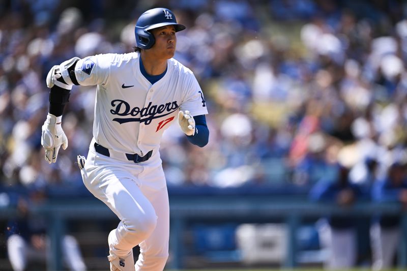 Apr 20, 2024; Los Angeles, California, USA; Los Angeles Dodgers designated hitter Shohei Ohtani (17) doubles against the New York Mets during the fifth inning at Dodger Stadium. Mandatory Credit: Jonathan Hui-USA TODAY Sports