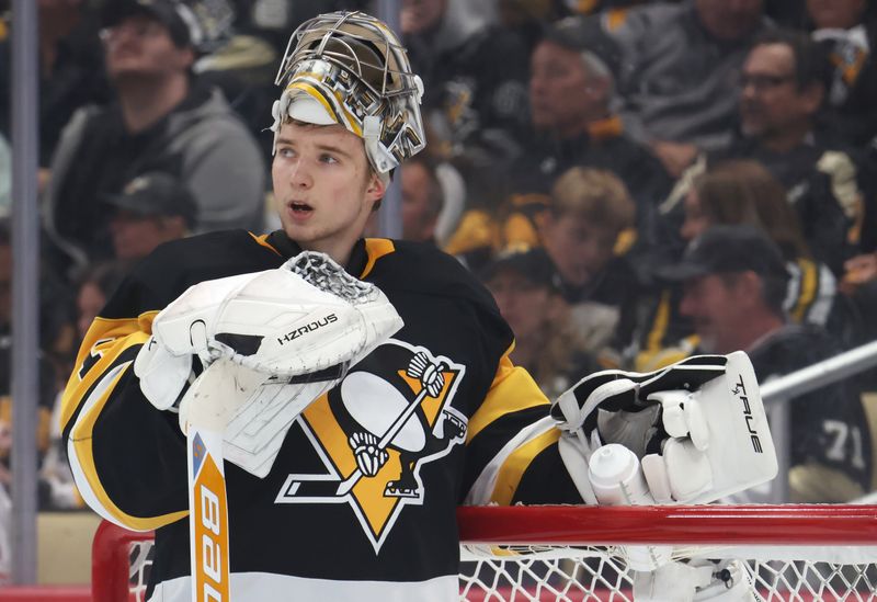 Nov 9, 2025; Pittsburgh, Pennsylvania, USA;  Pittsburgh Penguins goaltender Sergei Murashov (1) looks on during the second period of his NHL debut against the Los Angeles Kings at PPG Paints Arena. Mandatory Credit: Charles LeClaire-Imagn Images