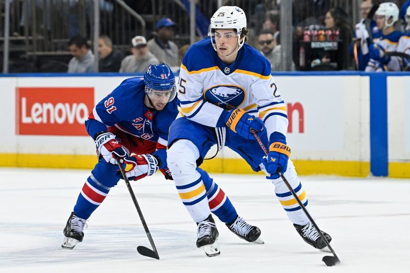 Nov 7, 2024; New York, New York, USA;  Buffalo Sabres defenseman Owen Power (25) skates the puck into the zone chased by New York Rangers right wing Reilly Smith (91) during the first period at Madison Square Garden. Mandatory Credit: Dennis Schneidler-Imagn Images