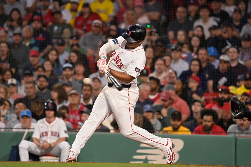 May 14, 2024; Boston, Massachusetts, USA; Boston Red Sox third baseman Rafael Devers (11) bats against the Tampa Bay Rays during the fourth inning at Fenway Park. Mandatory Credit: Eric Canha-USA TODAY Sports