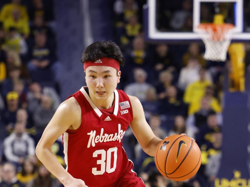 Feb 8, 2023; Ann Arbor, Michigan, USA;  Nebraska Cornhuskers guard Keisei Tominaga (30) dribbles in the second half against the Michigan Wolverines at Crisler Center. Mandatory Credit: Rick Osentoski-USA TODAY Sports