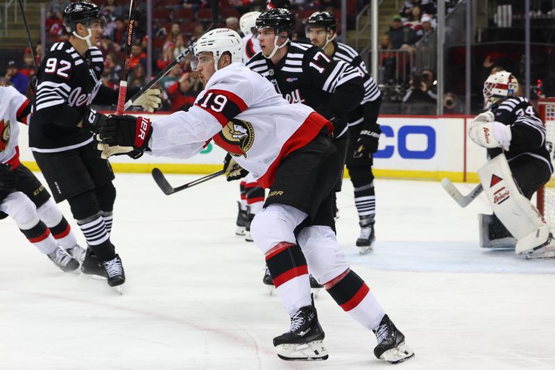 Mar 23, 2024; Newark, New Jersey, USA; Ottawa Senators right wing Drake Batherson (19) celebrates his goal against the New Jersey Devils during the third period at Prudential Center. Mandatory Credit: Ed Mulholland-USA TODAY Sports