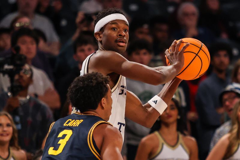 Mar 4, 2026; Atlanta, Georgia, USA; Georgia Tech Yellow Jackets forward Kowacie Reeves Jr. (14) looks for a pass against California Golden Bears guard Semetri (tt) Carr (3) during the second half at McCamish Pavilion. Mandatory Credit: Jordan Godfree-Imagn Images