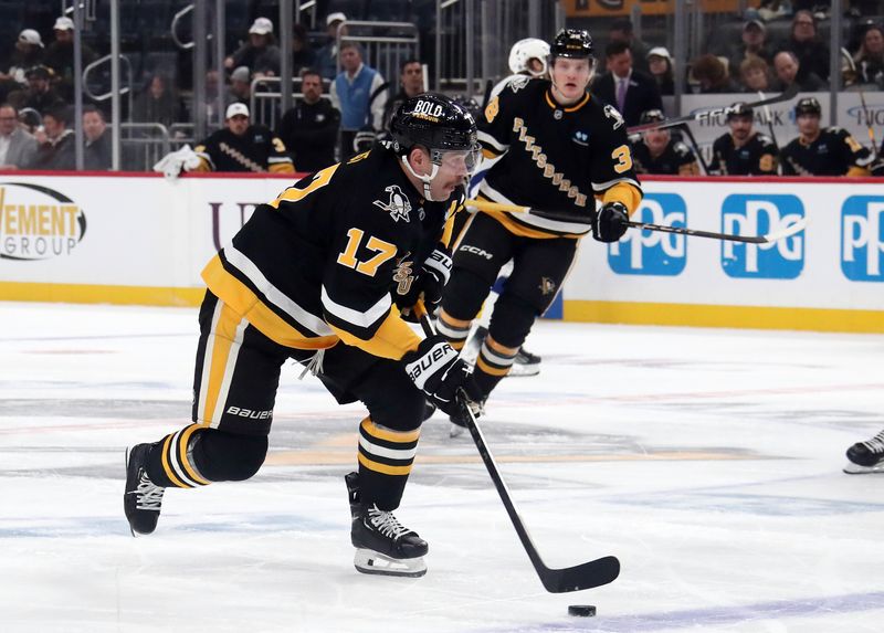 Nov 19, 2024; Pittsburgh, Pennsylvania, USA;  Pittsburgh Penguins right wing Bryan Rust (17) skates with the puck against the Tampa Bay Lightning during the first period at PPG Paints Arena. Mandatory Credit: Charles LeClaire-Imagn Images