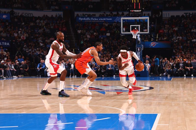 OKLAHOMA CITY, OK - FEBRUARY 27: Aaron Holiday #0 of the Houston Rockets dribbles the ball during the game against the Oklahoma City Thunder on February, 2024 at Paycom Arena in Oklahoma City, Oklahoma. NOTE TO USER: User expressly acknowledges and agrees that, by downloading and or using this photograph, User is consenting to the terms and conditions of the Getty Images License Agreement. Mandatory Copyright Notice: Copyright 2024 NBAE (Photo by Zach Beeker/NBAE via Getty Images)