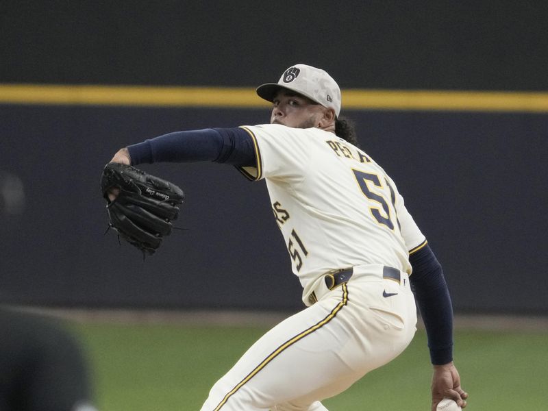 May 18, 2025; Milwaukee, Wisconsin, USA; Milwaukee Brewers pitcher Freddy Peralta (51) delivers a pitch in the first inning against the Minnesota Twins at American Family Field. Mandatory Credit: Michael McLoone-Imagn Images