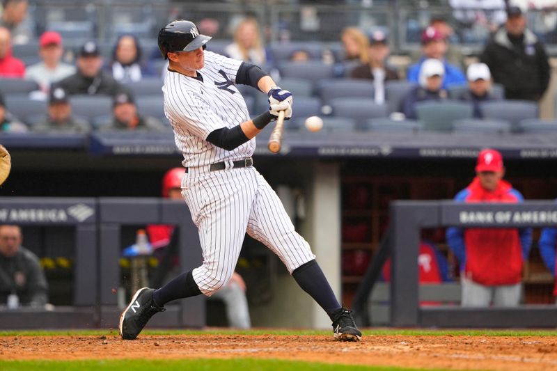 Apr 5, 2023; Bronx, New York, USA;  New York Yankees second baseman DJ LeMahieu (26) hits a double against the Philadelphia Phillies during the sixth inning at Yankee Stadium. Mandatory Credit: Gregory Fisher-USA TODAY Sports