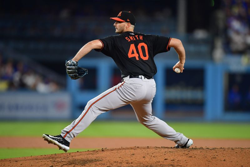 Aug 29, 2024; Los Angeles, California, USA; Baltimore Orioles pitcher Burch Smith (40) throws against the Los Angeles Dodgers during the fourth inning at Dodger Stadium. Mandatory Credit: Gary A. Vasquez-USA TODAY Sports