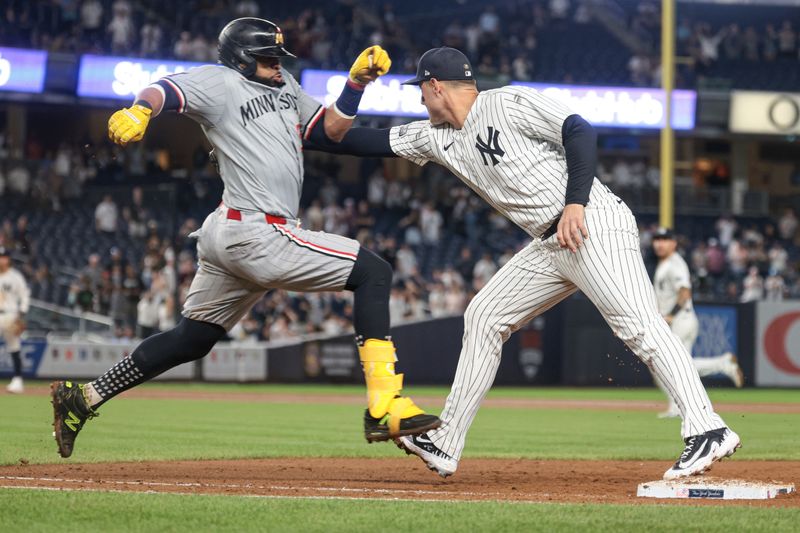 Jun 6, 2024; Bronx, New York, USA; New York Yankees first baseman Anthony Rizzo (48) catches the ball forcing out Minnesota Twins first baseman Carlos Santana (30) during the ninth inning at Yankee Stadium. Mandatory Credit: Vincent Carchietta-USA TODAY Sports