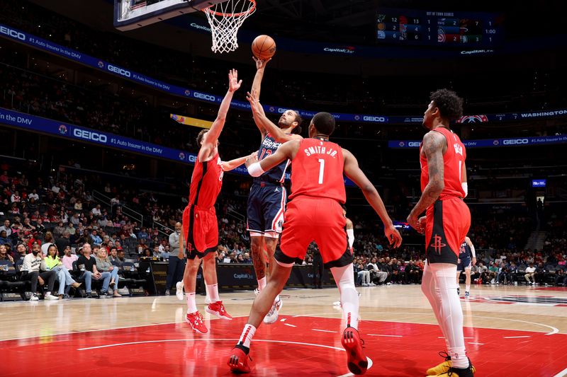 WASHINGTON, DC -? APRIL 9: Xavier Cooks #12 of the Washington Wizards drives to the basket against the Houston Rockets on April 9, 2023 at Capital One Arena in Washington, DC. NOTE TO USER: User expressly acknowledges and agrees that, by downloading and or using this Photograph, user is consenting to the terms and conditions of the Getty Images License Agreement. Mandatory Copyright Notice: Copyright 2023 NBAE (Photo by Stephen Gosling/NBAE via Getty Images)