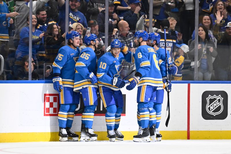 Nov 4, 2023; St. Louis, Missouri, USA; St. Louis Blues center Brayden Schenn (10) is congratulated by teammates after scoring a goal against the Montreal Canadiens during the third period at Enterprise Center. Mandatory Credit: Jeff Le-USA TODAY Sports