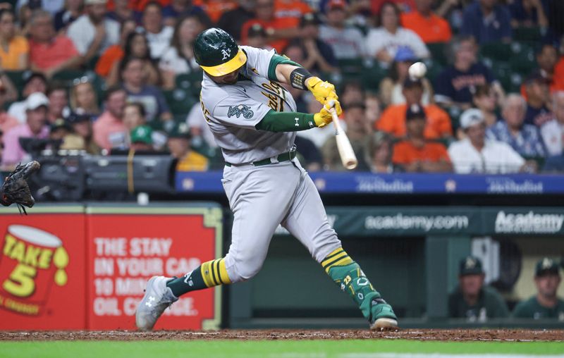 Sep 11, 2023; Houston, Texas, USA; Oakland Athletics catcher Shea Langeliers (23) hits a home run during the seventh inning against the Houston Astros at Minute Maid Park. Mandatory Credit: Troy Taormina-USA TODAY Sports