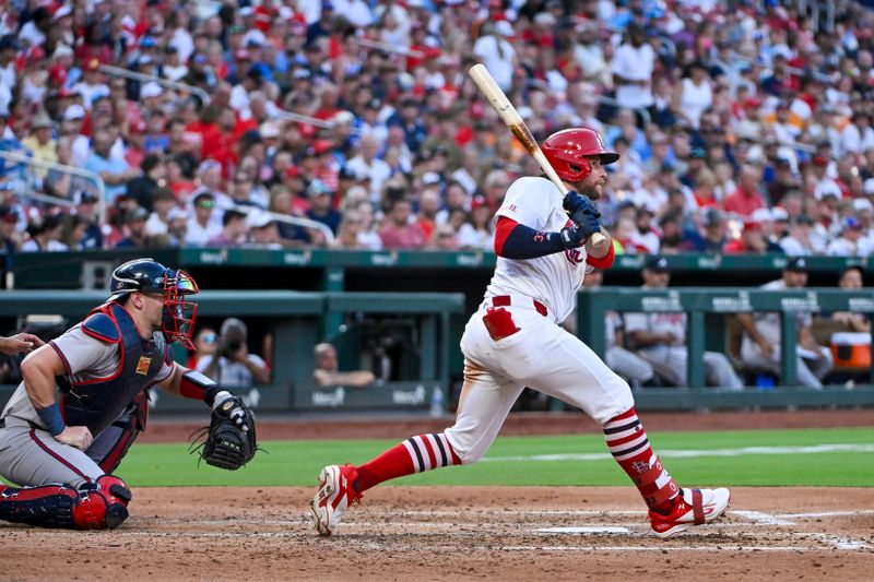 Jun 24, 2024; St. Louis, Missouri, USA;  St. Louis Cardinals left fielder Brendan Donovan (33) hits a one run single against the Atlanta Braves during the third inning at Busch Stadium. Mandatory Credit: Jeff Curry-USA TODAY Sports