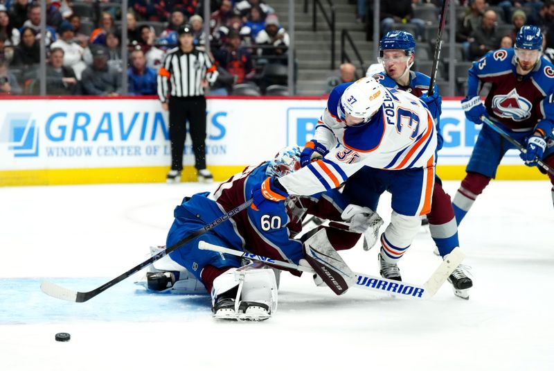 Apr 18, 2024; Denver, Colorado, USA; Colorado Avalanche defenseman Cale Makar (8) and goaltender Justus Annunen (60) defend on Edmonton Oilers left wing Warren Foegele (37) in the third period at Ball Arena. Mandatory Credit: Ron Chenoy-USA TODAY Sports