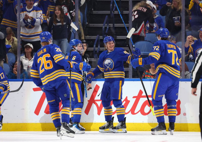 Oct 18, 2025; Buffalo, New York, USA;  Buffalo Sabres right wing Josh Doan (91) celebrates his goal with teammates during the first period against the Florida Panthers at KeyBank Center. Mandatory Credit: Timothy T. Ludwig-Imagn Images