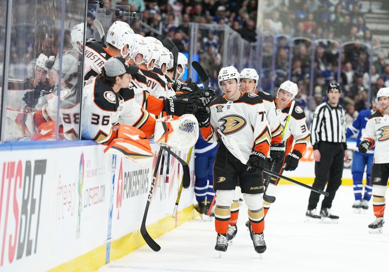 Feb 17, 2024; Toronto, Ontario, CAN; Anaheim Ducks right wing Frank Vatrano (77) celebrates at the bench after scoring a goal against the Toronto Maple Leafs during the first period at Scotiabank Arena. Mandatory Credit: Nick Turchiaro-USA TODAY Sports