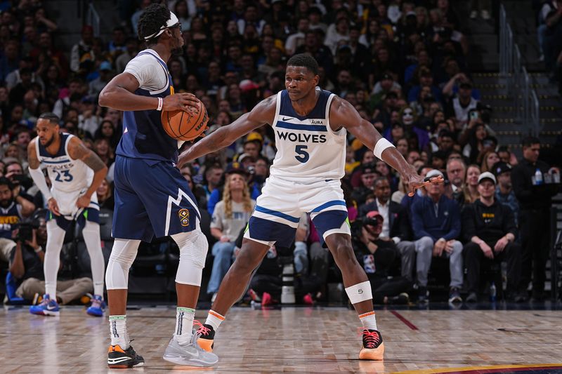 DENVER, CO - APRIL 10:  Anthony Edwards #5 of the Minnesota Timberwolves plays defense during the game against the Denver Nuggets on April 10, 2024 at the Ball Arena in Denver, Colorado. NOTE TO USER: User expressly acknowledges and agrees that, by downloading and/or using this Photograph, user is consenting to the terms and conditions of the Getty Images License Agreement. Mandatory Copyright Notice: Copyright 2024 NBAE (Photo by Bart Young/NBAE via Getty Images)