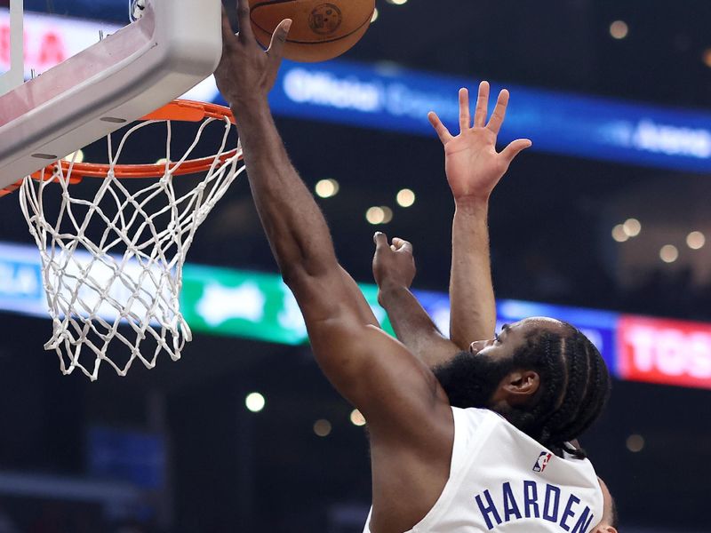 LOS ANGELES, CALIFORNIA - FEBRUARY 25: James Harden #1 of the Los Angeles Clippers drives to the basket against Chris Duarte #3 of the Sacramento Kings during the second quarter at Crypto.com Arena on February 25, 2024 in Los Angeles, California. The Sacramento Kings defeated the Los Angeles Clippers 123-107. NOTE TO USER: User expressly acknowledges and agrees that, by downloading and or using this photograph, User is consenting to the terms and conditions of the Getty Images License Agreement. (Photo by Katelyn Mulcahy/Getty Images)