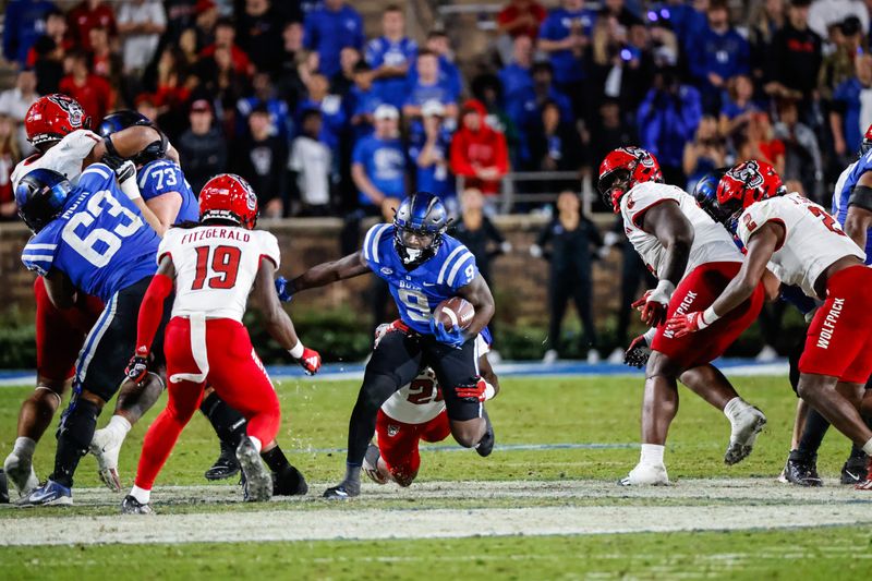 Oct 14, 2023; Durham, North Carolina, USA; Duke Blue Devils wide receiver Jordan Moore (8) runs with the ball during the second half of the game against North Carolina State Wolfpack at Wallace Wade Stadium. Mandatory Credit: Jaylynn Nash-USA TODAY Sports