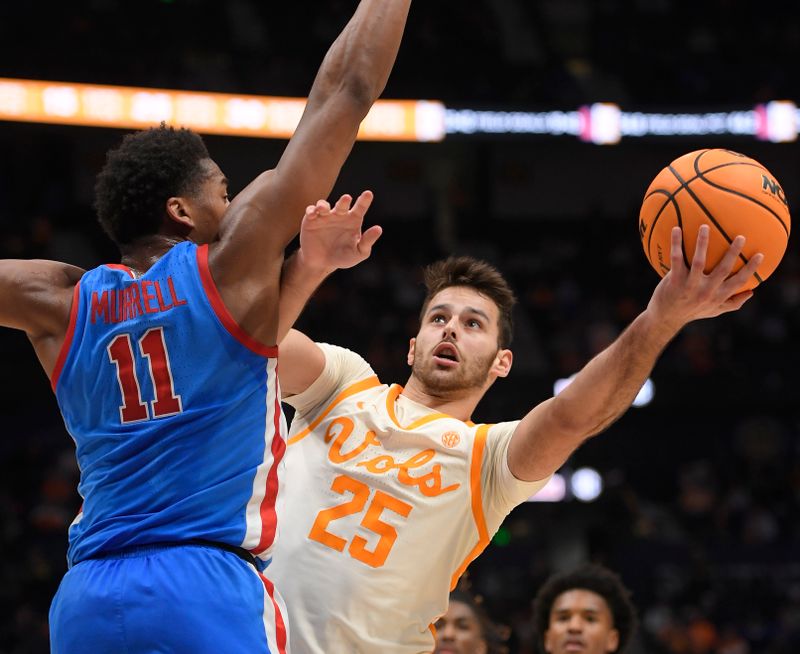 Mar 9, 2023; Nashville, TN, USA;  Tennessee Volunteers guard Santiago Vescovi (25) shoots under the arm of Mississippi Rebels guard Matthew Murrell (11) during the second half at Bridgestone Arena. Mandatory Credit: Steve Roberts-USA TODAY Sports