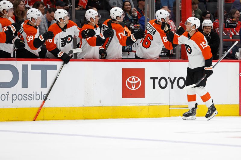 Sep 22, 2024; Washington, District of Columbia, USA; Philadelphia Flyers forward Olle Lycksell (15) celebrates with teammates after scoring a goal against the Washington Capitals in the third period at Capital One Arena. Mandatory Credit: Geoff Burke-Imagn Images