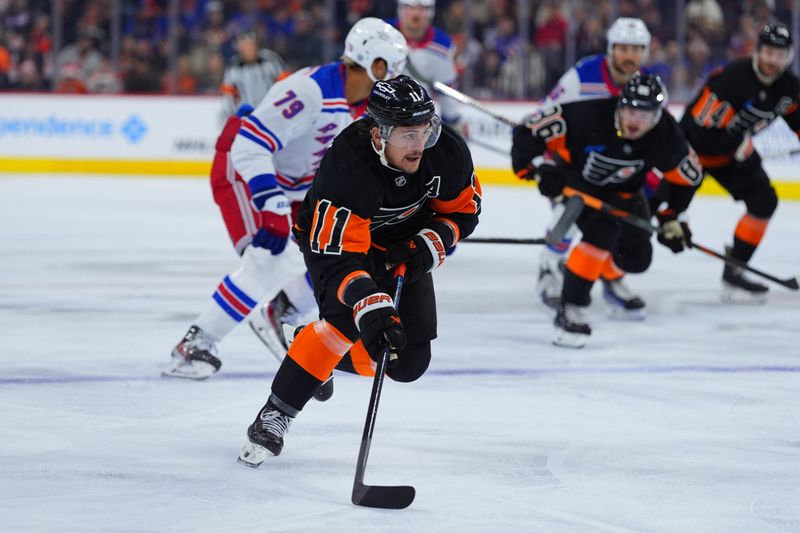 Nov 29, 2024; Philadelphia, Pennsylvania, USA; Philadelphia Flyers right wing Travis Konecny (11) controls the puck against the New York Rangers in the first period at Wells Fargo Center. Mandatory Credit: Kyle Ross-Imagn Images