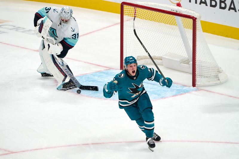 Nov 29, 2024; San Jose, California, USA; San Jose Sharks right wing Ethan Cardwell (56) reacts after scoring a goal against Seattle Kraken goaltender Philipp Grubauer (31) during the third period at SAP Center at San Jose. Mandatory Credit: Robert Edwards-Imagn Images
