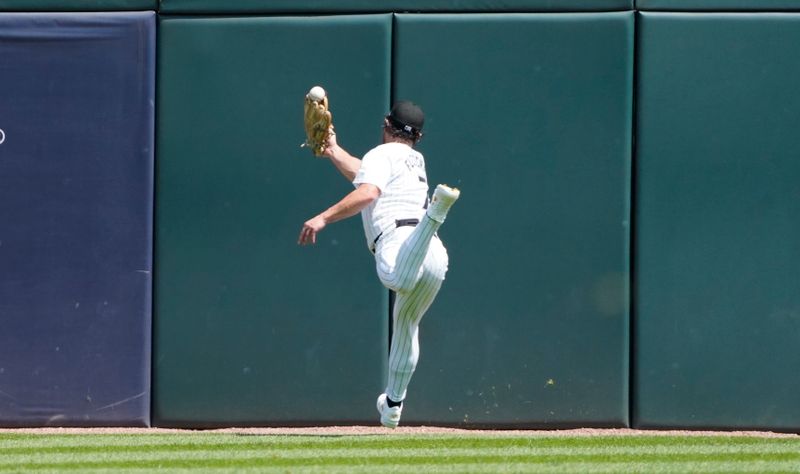 Jul 31, 2024; Chicago, Illinois, USA; Chicago White Sox outfielder Dominic Fletcher (7) cannot catch a ball hit for a double hit by Kansas City Royals catcher Salvador Perez (not pictured) during the fifth inning at Guaranteed Rate Field. Mandatory Credit: David Banks-USA TODAY Sports