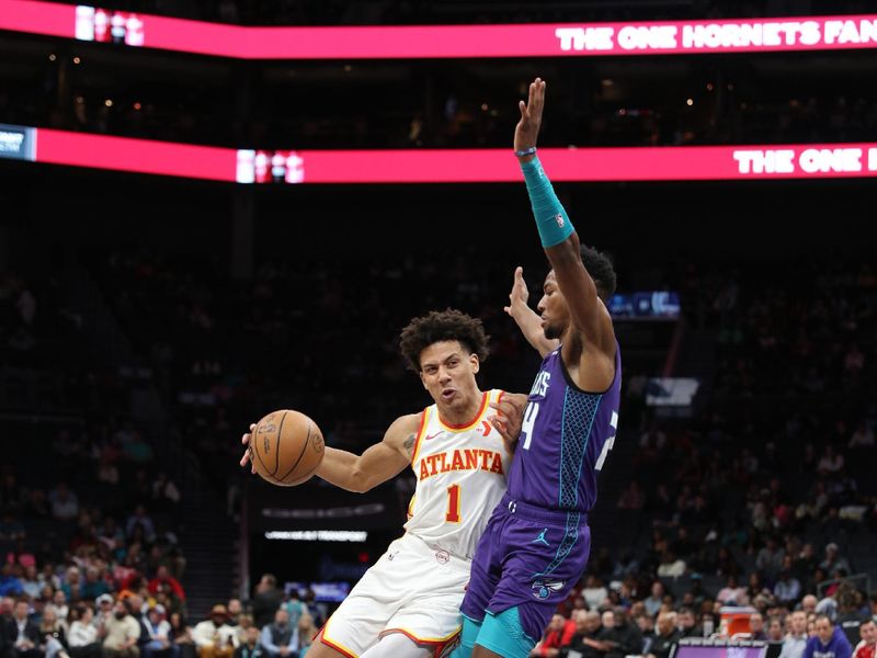 CHARLOTTE, NC - FEBRUARY 14: Jalen Johnson #1 of the Atlanta Hawks handles the ball during the game against the Charlotte Hornets on February 14, 2024 at Spectrum Center in Charlotte, North Carolina. NOTE TO USER: User expressly acknowledges and agrees that, by downloading and or using this photograph, User is consenting to the terms and conditions of the Getty Images License Agreement.  Mandatory Copyright Notice:  Copyright 2024 NBAE (Photo by Brock Williams-Smith/NBAE via Getty Images)