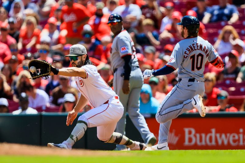 May 18, 2025; Cincinnati, Ohio, USA; Cincinnati Reds first baseman Connor Joe (17) attempts to tag Cleveland Guardians second baseman Daniel Schneemann (10) out at first in the fourth inning at Great American Ball Park. Mandatory Credit: Katie Stratman-Imagn Images