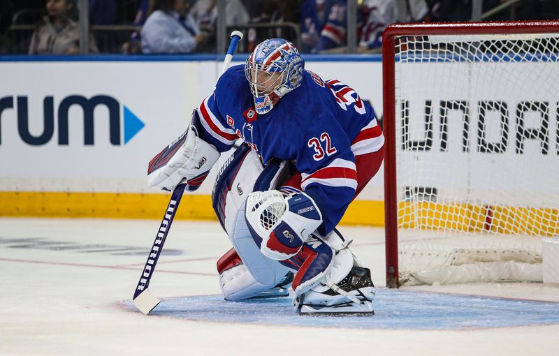 Sep 24, 2024; New York, New York, USA; New York Rangers goalie Jonathan Quick (32) warms up during the second period against the New York Islanders at Madison Square Garden. Mandatory Credit: Danny Wild-Imagn Images