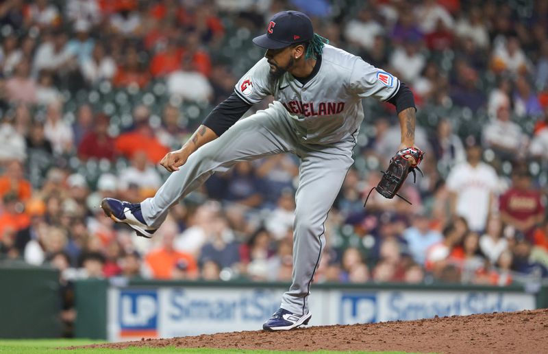 May 1, 2024; Houston, Texas, USA;  Cleveland Guardians relief pitcher Emmanuel Clase (48) delivers a pitch during the tenth inning against the Houston Astros at Minute Maid Park. Mandatory Credit: Troy Taormina-USA TODAY Sports