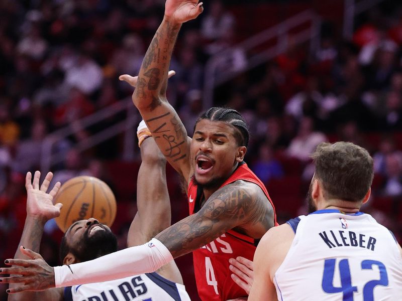 HOUSTON, TEXAS - JANUARY 01: Jalen Green #4 of the Houston Rockets draws a foul against Kyrie Irving #11 of the Dallas Mavericks during the second half at Toyota Center on January 01, 2025 in Houston, Texas. NOTE TO USER: User expressly acknowledges and agrees that, by downloading and or using this photograph, User is consenting to the terms and conditions of the Getty Images License Agreement. (Photo by Alex Slitz/Getty Images)