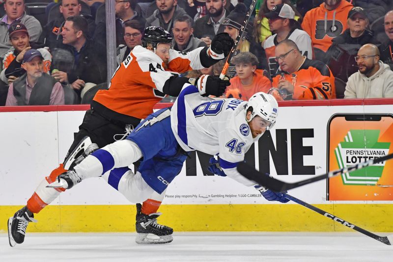 Feb 27, 2024; Philadelphia, Pennsylvania, USA; Philadelphia Flyers left wing Nicolas Deslauriers (44) checks Tampa Bay Lightning defenseman Nick Perbix (48) during the first period at Wells Fargo Center. Mandatory Credit: Eric Hartline-USA TODAY Sports