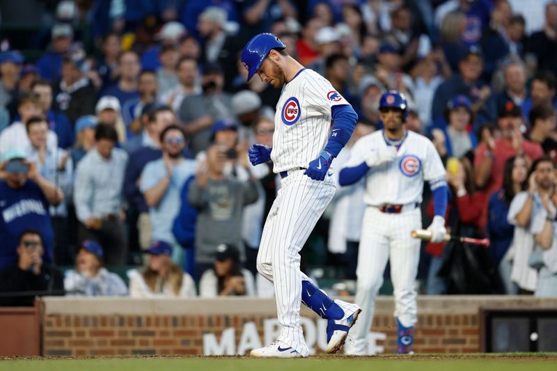 May 7, 2024; Chicago, Illinois, USA; Chicago Cubs outfielder Cody Bellinger (24) crosses home plate after hitting a solo home run against the San Diego Padres during the fourth inning at Wrigley Field. Mandatory Credit: Kamil Krzaczynski-USA TODAY Sports