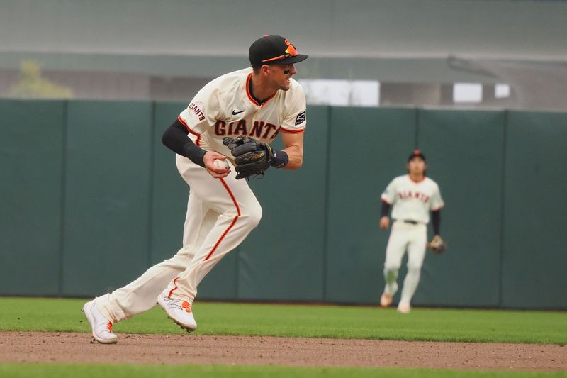 Apr 24, 2024; San Francisco, California, USA; San Francisco Giants shortstop Nick Ahmed (16) starts a double play against the New York Mets during the seventh inning at Oracle Park. Mandatory Credit: Kelley L Cox-USA TODAY Sports