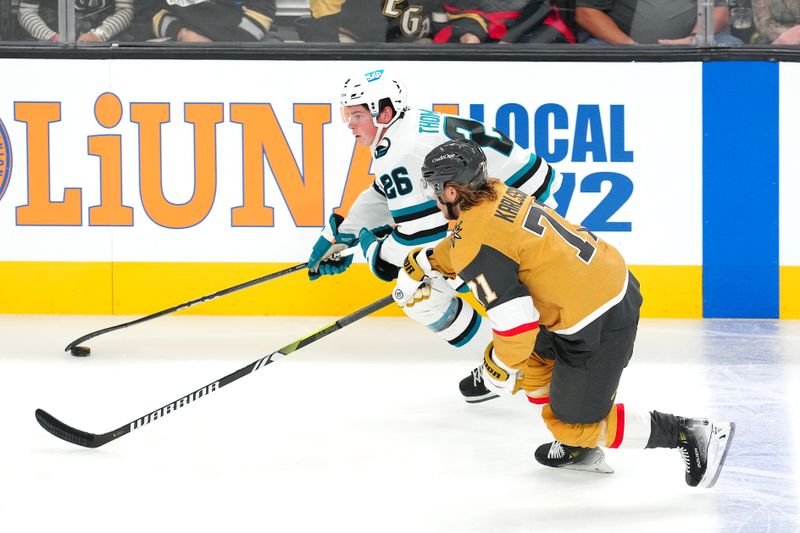 Oct 26, 2024; Las Vegas, Nevada, USA; San Jose Sharks defenseman Jack Thompson (26) skates beside Vegas Golden Knights center William Karlsson (71) during the third period at T-Mobile Arena. Mandatory Credit: Stephen R. Sylvanie-Imagn Images