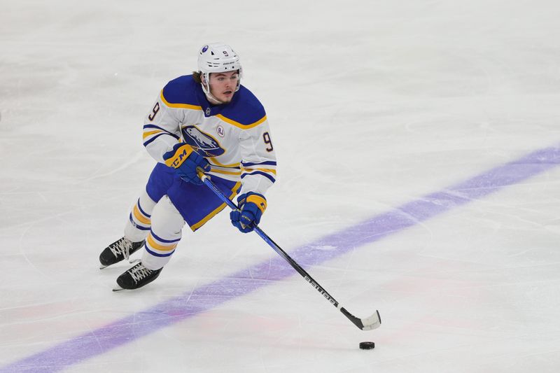 Feb 27, 2024; Sunrise, Florida, USA; Buffalo Sabres left wing Zach Benson (9) moves the puck against the Florida Panthers during the first period at Amerant Bank Arena. Mandatory Credit: Sam Navarro-USA TODAY Sports