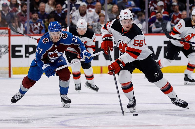 Nov 7, 2023; Denver, Colorado, USA; New Jersey Devils left wing Erik Haula (56) controls the puck ahead of Colorado Avalanche left wing Jonathan Drouin (27) in the first period at Ball Arena. Mandatory Credit: Isaiah J. Downing-USA TODAY Sports