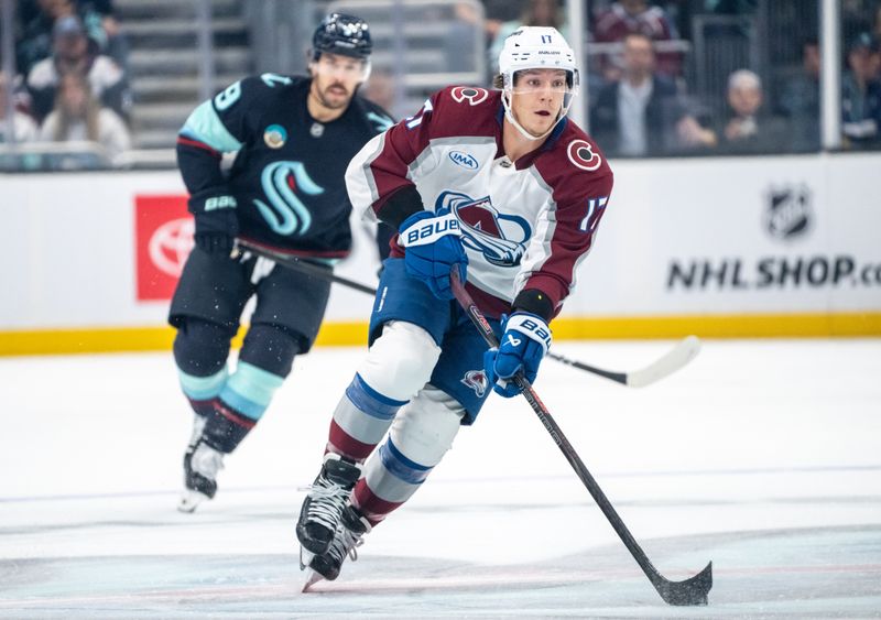 Oct 22, 2024; Seattle, Washington, USA;  Colorado Avalanche forward Parker Kelly (17) skates against Seattle Kraken forward Chandler Stephenson (9) during the first period at Climate Pledge Arena. Mandatory Credit: Stephen Brashear-Imagn Images