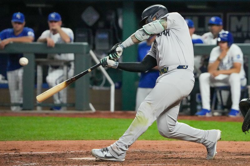 Jun 12, 2024; Kansas City, Missouri, USA; New York Yankees second baseman Gleyber Torres (25) hits a three run home run against the Kansas City Royals in the seventh inning at Kauffman Stadium. Mandatory Credit: Denny Medley-USA TODAY Sports