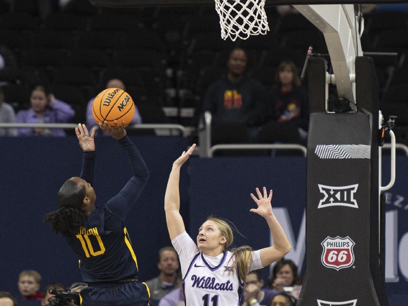 Mar 9, 2024; Kansas City, MO, USA; West Virginia Mountaineers guard Jordan Harrison (10) shoots the ball while defended by Kansas State Wildcats guard Taryn Sides (11) during the second half at T-Mobile Center. Mandatory Credit: Amy Kontras-USA TODAY Sports