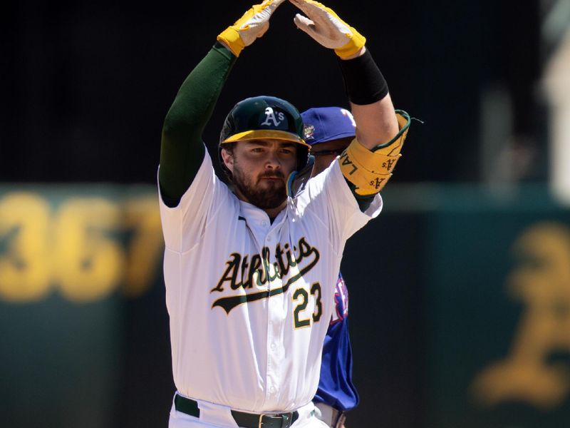 May 8, 2024; Oakland, California, USA; Oakland Athletics catcher Shea Langeliers (23) celebrates his two-RBI double against the Texas Rangers during the fourth inning at Oakland-Alameda County Coliseum. Mandatory Credit: D. Ross Cameron-USA TODAY Sports