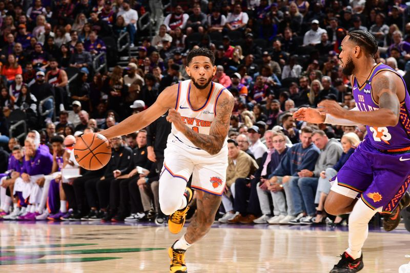 PHOENIX, AZ - NOVEMBER 20: Cameron Payne #1 of the New York Knicks dribbles the ball during the game against the Phoenix Suns on November 20, 2024 at Footprint Center in Phoenix, Arizona. NOTE TO USER: User expressly acknowledges and agrees that, by downloading and or using this photograph, user is consenting to the terms and conditions of the Getty Images License Agreement. Mandatory Copyright Notice: Copyright 2024 NBAE (Photo by Kate Frese/NBAE via Getty Images)