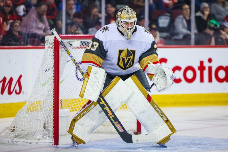 Mar 14, 2024; Calgary, Alberta, CAN; Vegas Golden Knights goaltender Adin Hill (33) guards his net against the Calgary Flames during the second period at Scotiabank Saddledome. Mandatory Credit: Sergei Belski-USA TODAY Sports