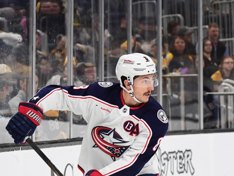 Nov 18, 2024; Boston, Massachusetts, USA;  Columbus Blue Jackets defenseman Zach Werenski (8) handles the puck during the first period against the Boston Bruins at TD Garden. Mandatory Credit: Bob DeChiara-Imagn Images