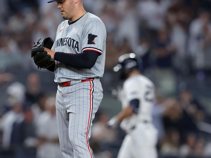 Jun 4, 2024; Bronx, New York, USA; Minnesota Twins relief pitcher Caleb Thielbar (56) reacts after giving up a two run home run to New York Yankees designated hitter Giancarlo Stanton (27) during the eighth inning at Yankee Stadium. Mandatory Credit: Brad Penner-USA TODAY Sports