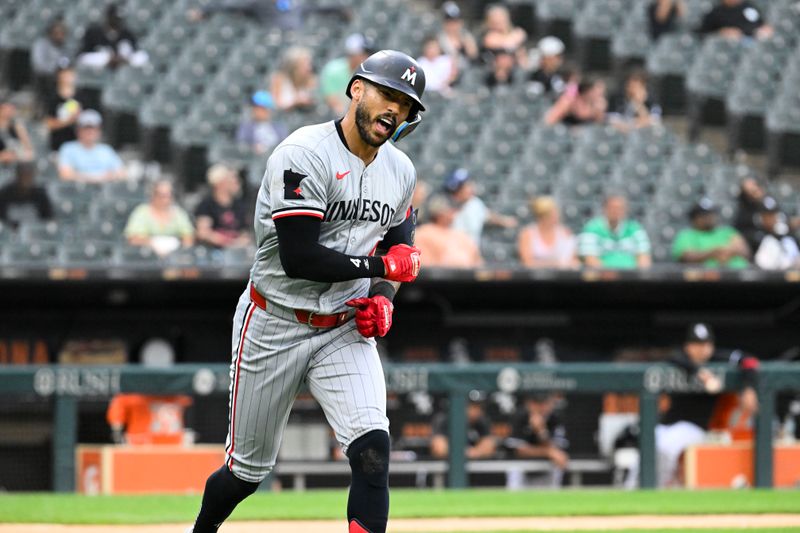 Jul 10, 2024; Chicago, Illinois, USA;  Minnesota Twins shortstop Carlos Correa (4) celebrates after hitting a home run against the Chicago White Sox during the sixth inning at Guaranteed Rate Field. Mandatory Credit: Matt Marton-USA TODAY Sports